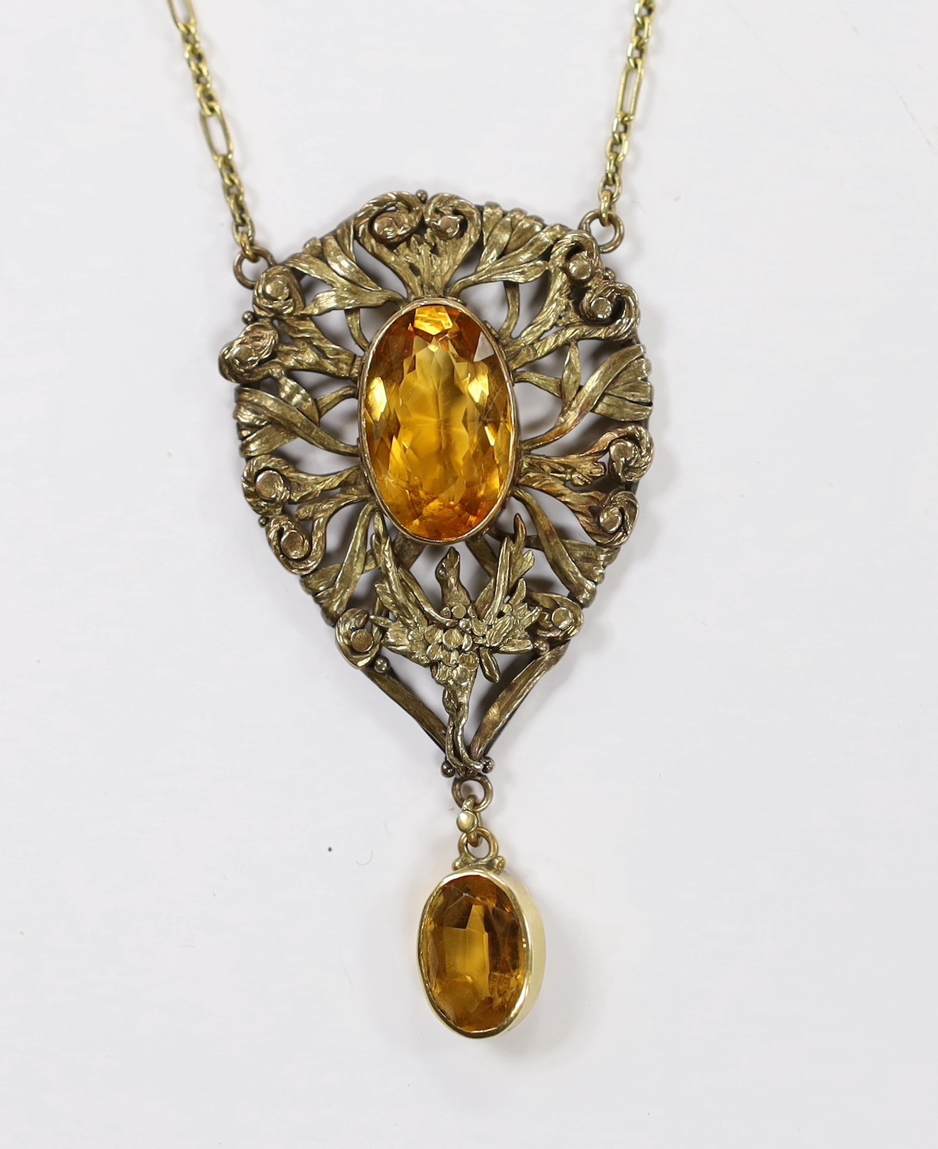 A yellow metal, white metal and two stone citrine set drop pendant necklace, with citrine set clasp, 58cm.